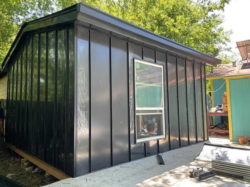 Black standing seam metal wall panels for Metal Roof Installation in Rogers