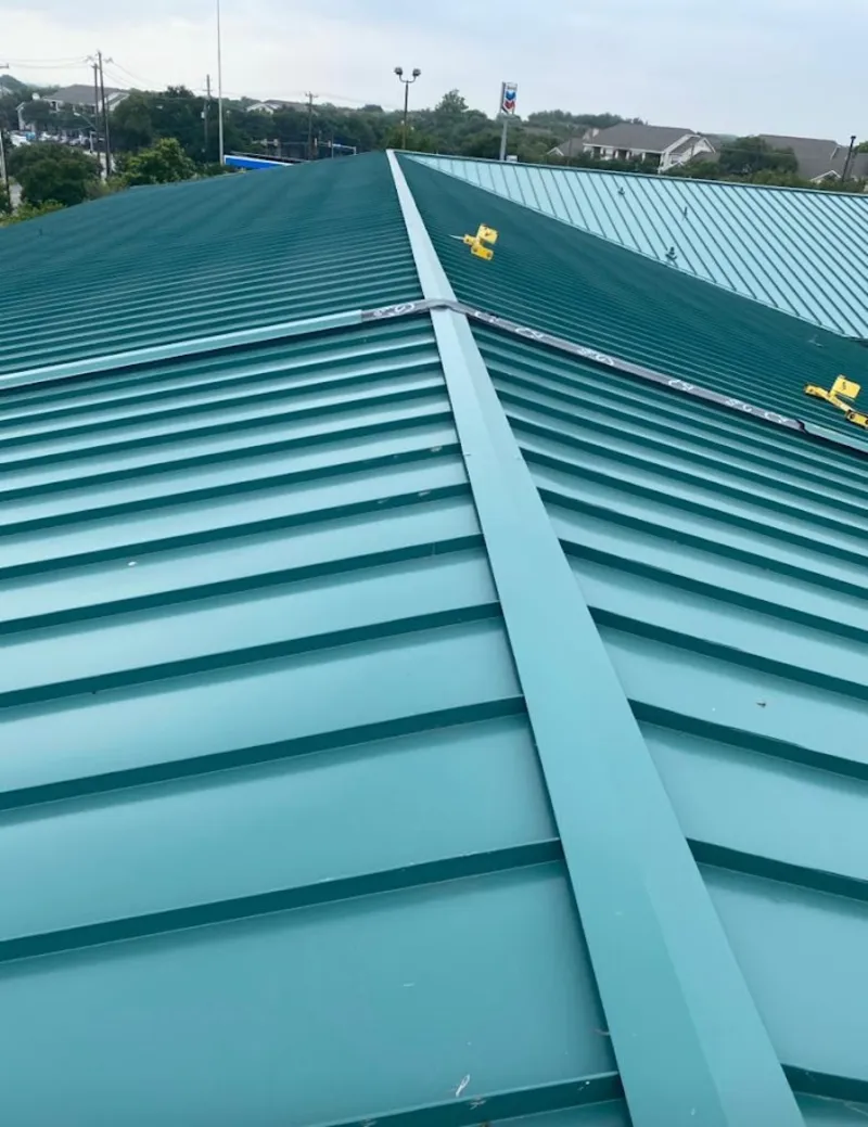 Green commercial metal roof ridge and valley for Metal Roof Repair in Rogers